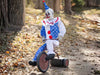 Animatronic payaso en triciclo de 81 cm con traje azul de lunares blancos y gorro azul