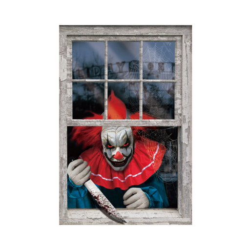 Decoración de ventana con payaso de terror con cuchillo asomado a una ventana