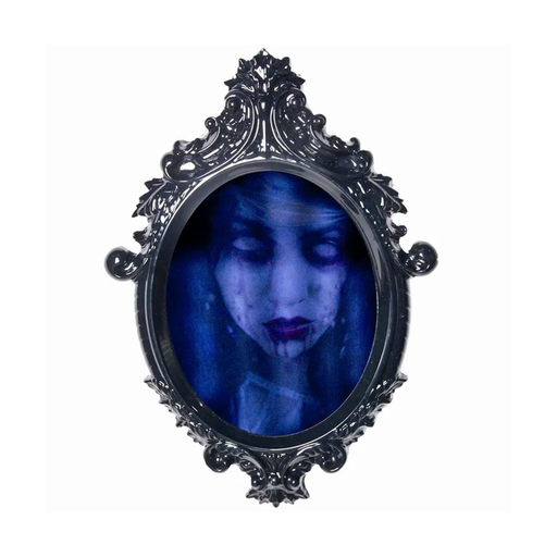 Espejo embrujado decorativo con marco negro ornamentado y rostro fantasmal azul