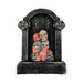 Tumba gris con inscripción RIP y calaveras iluminadas con luz roja